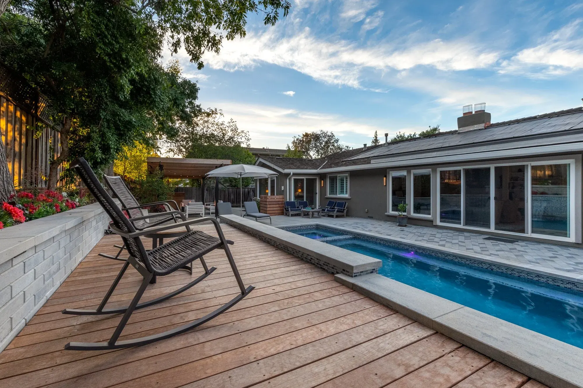 Hardwood deck beside a lap pool