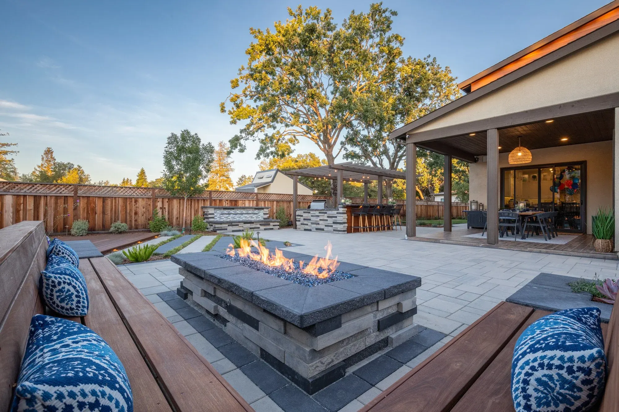 Fire table beside a cushioned built-in bench
