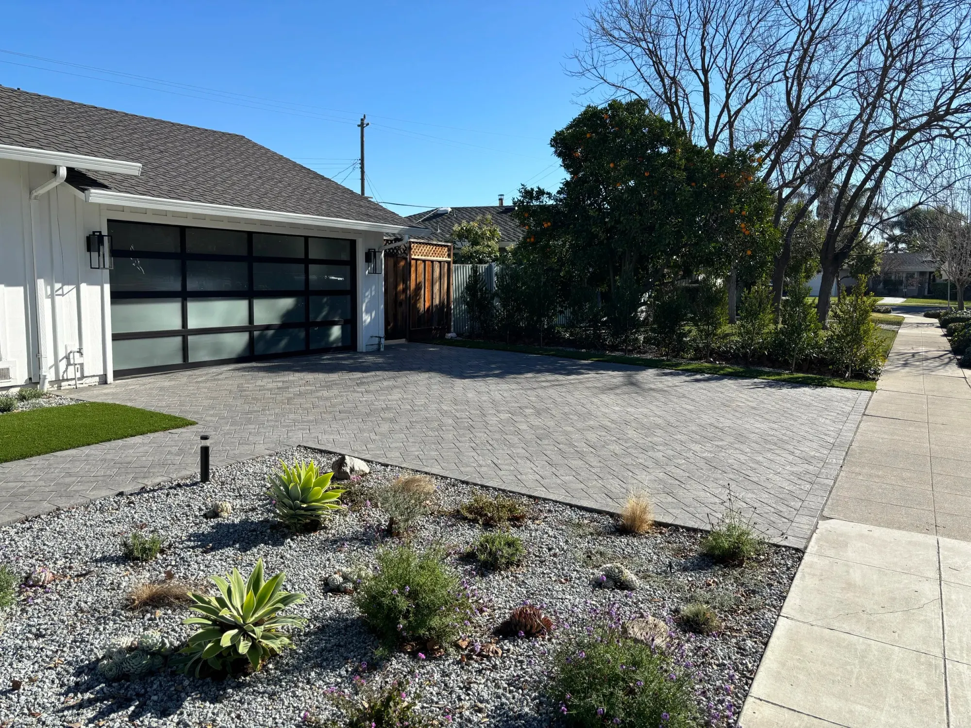 Gravel bed running beside a paver drive