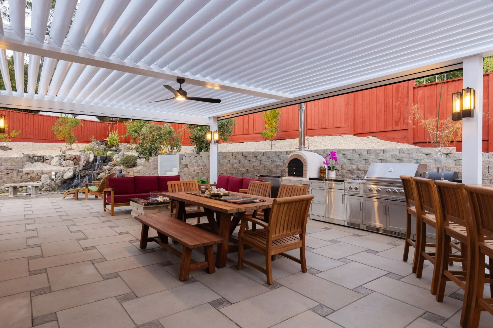 Louvered patio cover over an outdoor kitchen