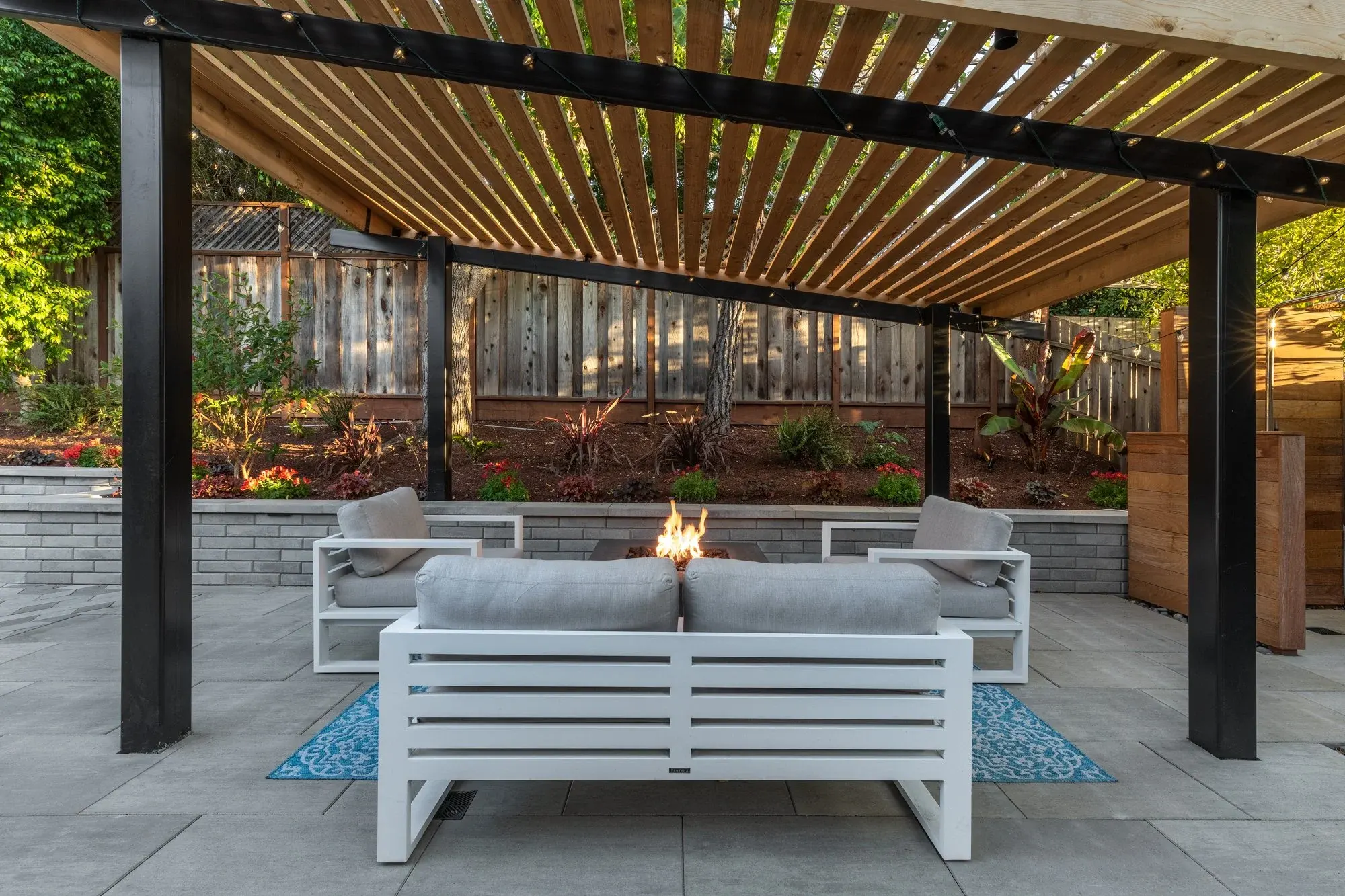 Lounge under a louvered pergola