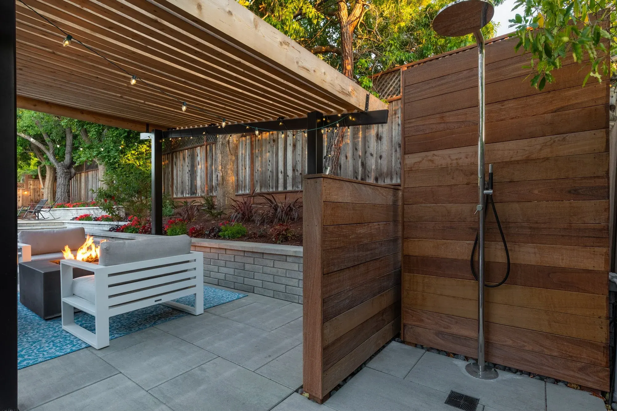 Outdoor shower behind a cedar screen