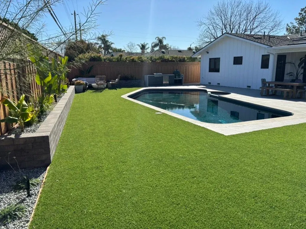 Pool at the end of a long turf lawn