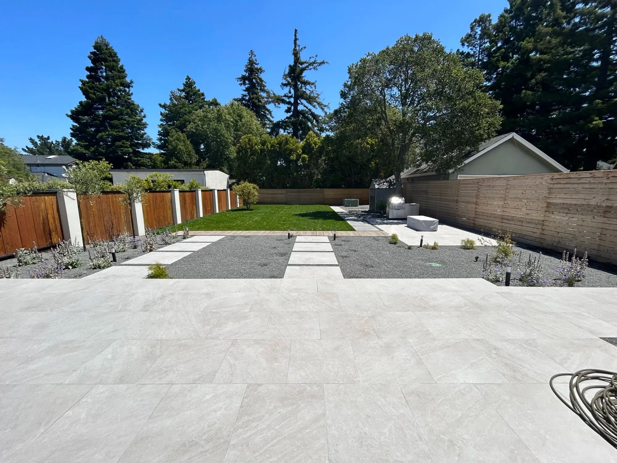 Concrete slab patio and a long garden bed