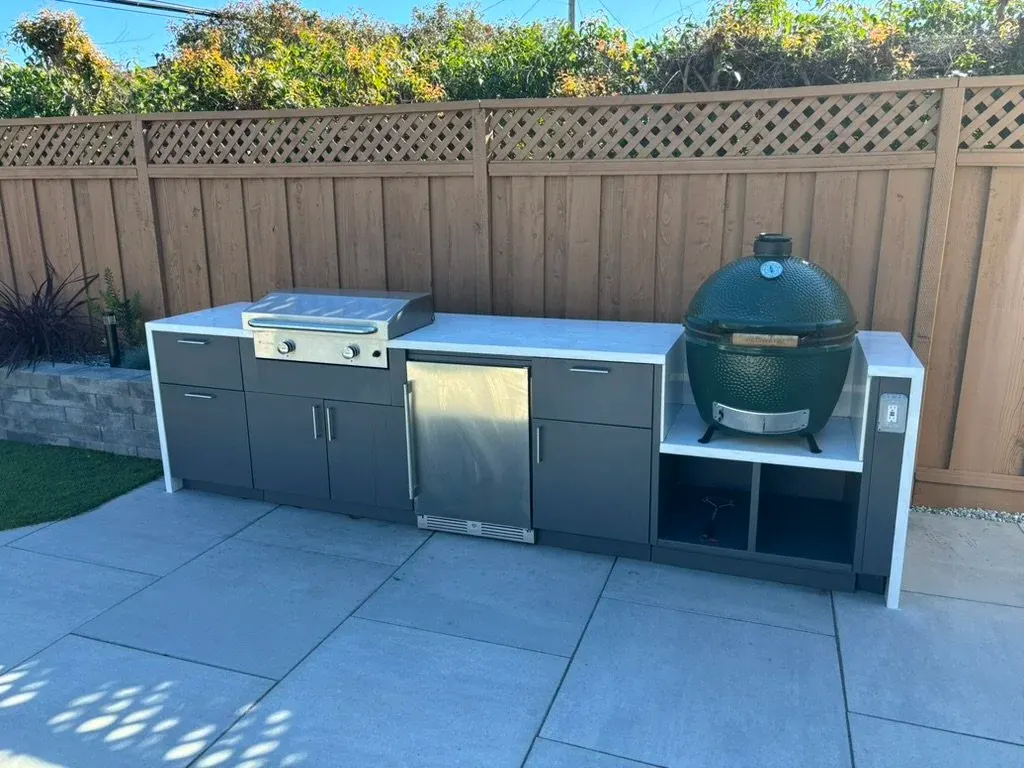 Stainless outdoor kitchen with a kamado grill
